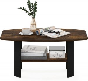 Wooden coffee table with a dark finish, displaying a cup of coffee, magazine, and glasses on top with books and decor on the lower shelf.